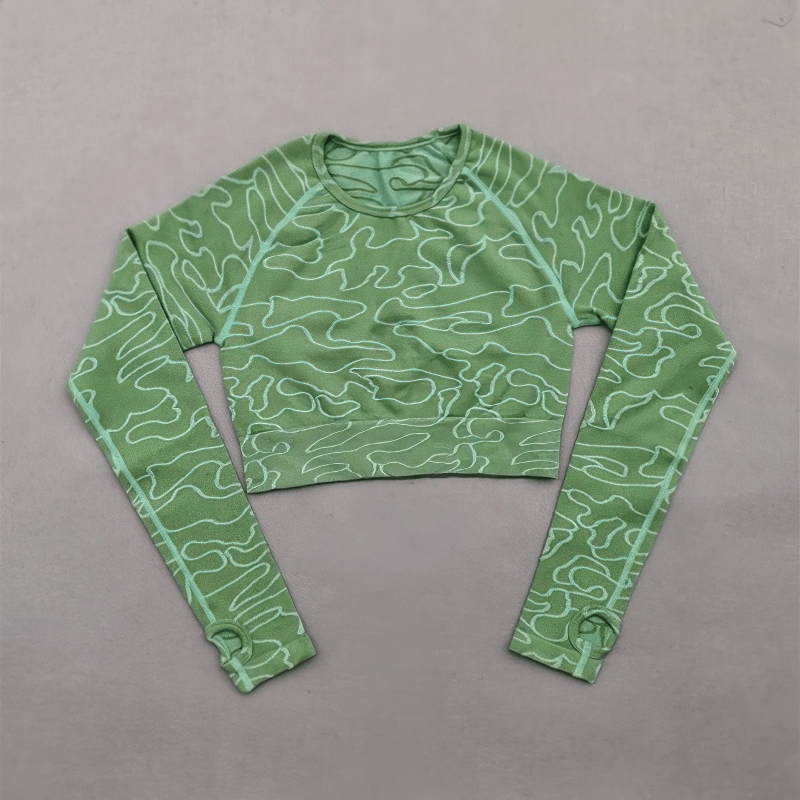 Green seamless long sleeves training crop top for women, perfect for sports and yoga, with quick-drying breathable fabric.